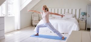 woman doing yoga as part of her morning routine