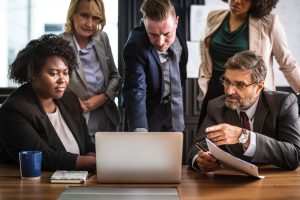 employees looking at computer concerned
