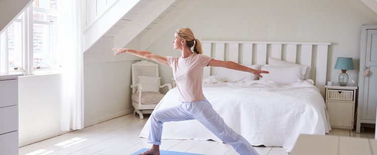 woman doing yoga as part of her morning routine